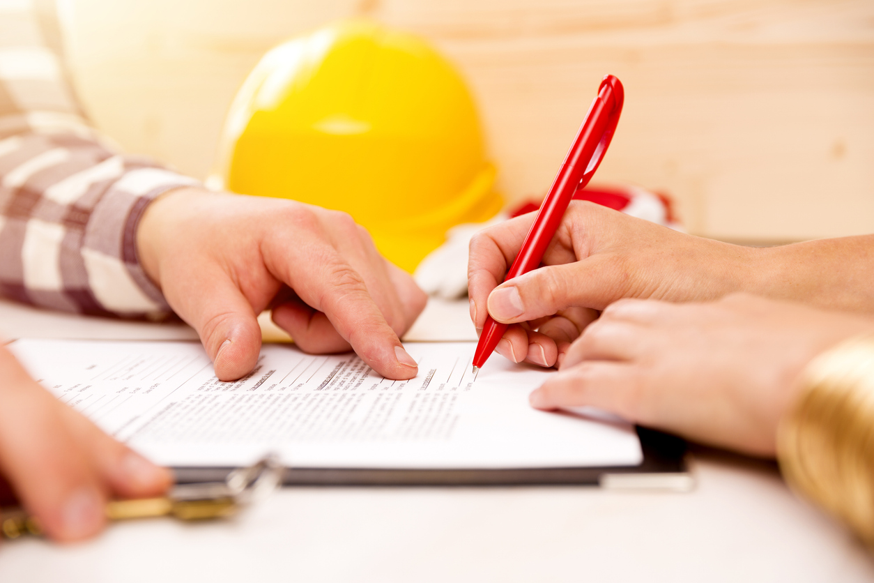 Signing an agreement for a commercial painting project in Moraga, CA