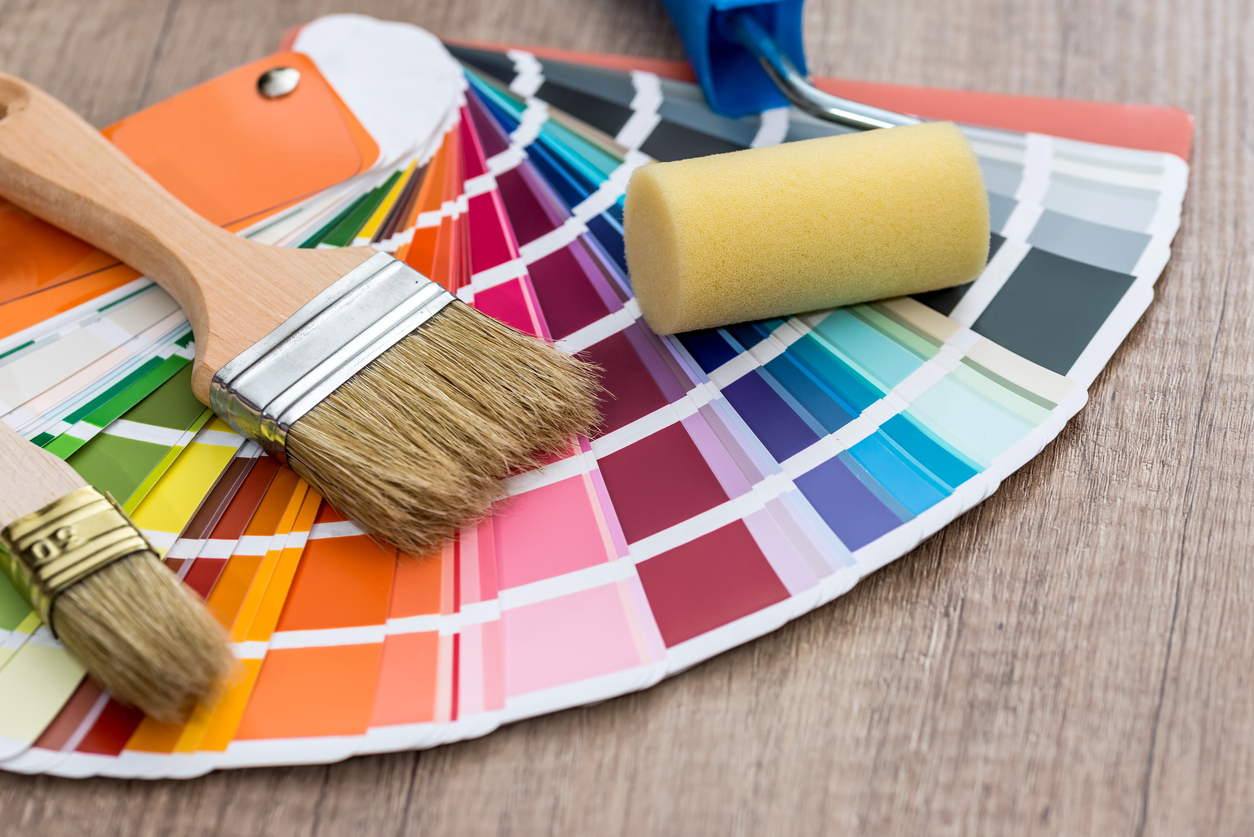 Paint brushes on colour swatch