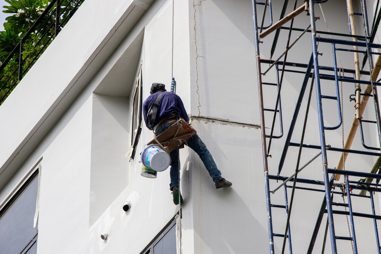 Painting the exterior of a large commercial building