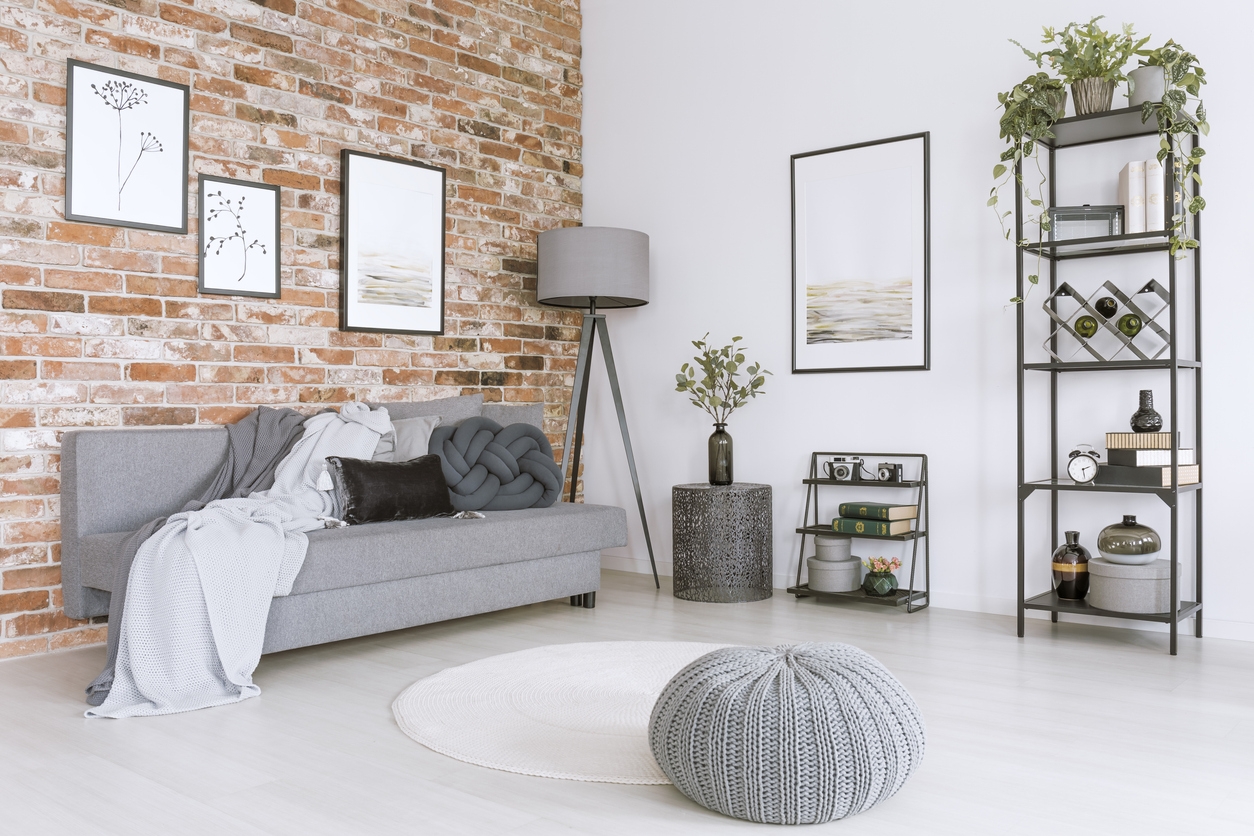 White and gray living room with interior brick in a Moraga, CA home